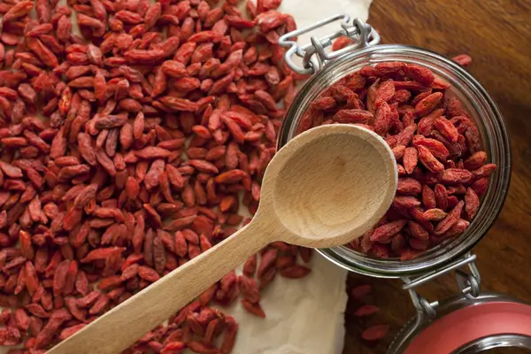 Goji berries on the wooden table — Stock Photo, Image