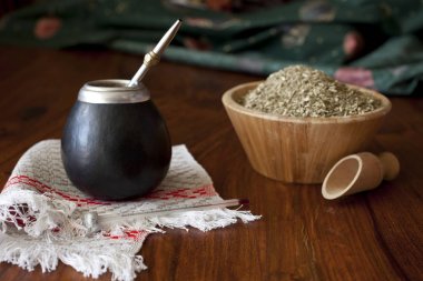 yerba mate in matero on a table clipart