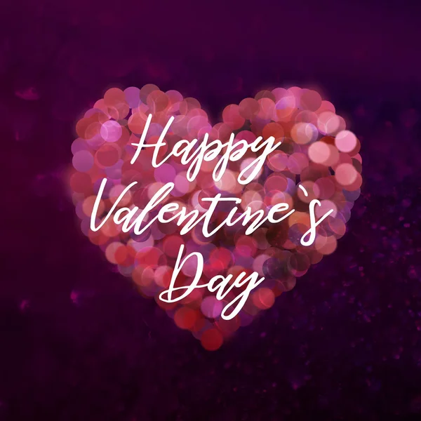 Valentine\'s day heart with sparkling bokeh effect and inscription