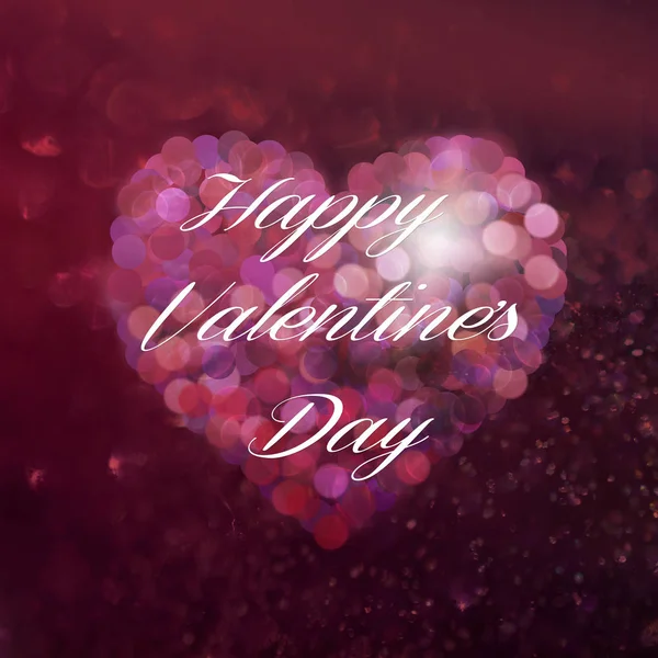 Valentine\'s day heart with sparkling bokeh effect and inscription