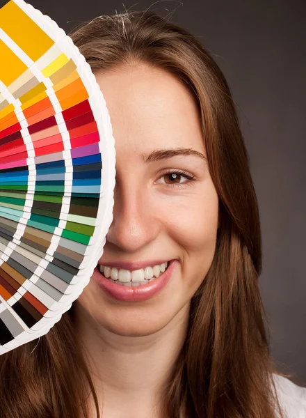 Woman holding a pantone palette — Stock Photo, Image