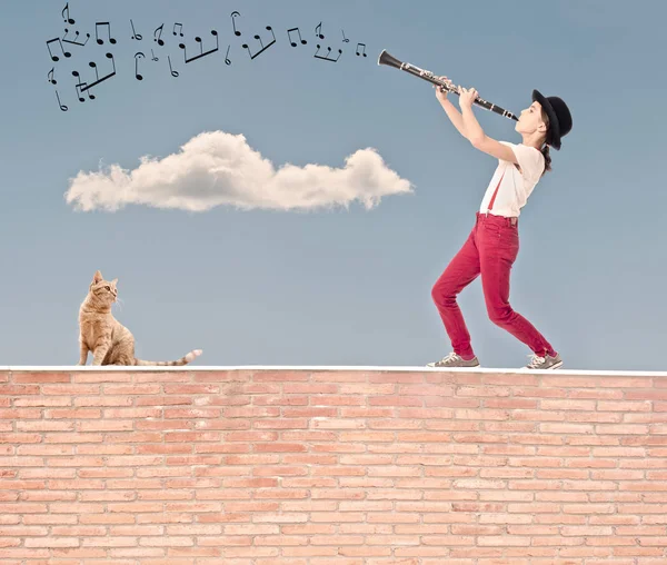 Little Girl Playing Clarinet Top Bricks Wall — Stock Photo, Image