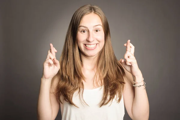 Young girl crossing fingers — Stock Photo, Image