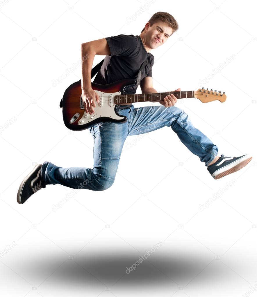 man jumping with electric guitar