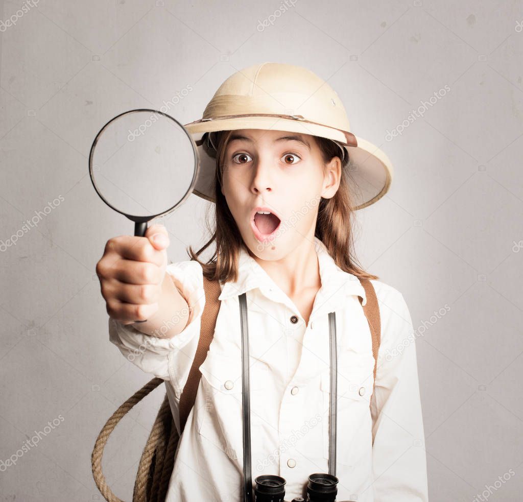 little explorer looking through magnifying glass