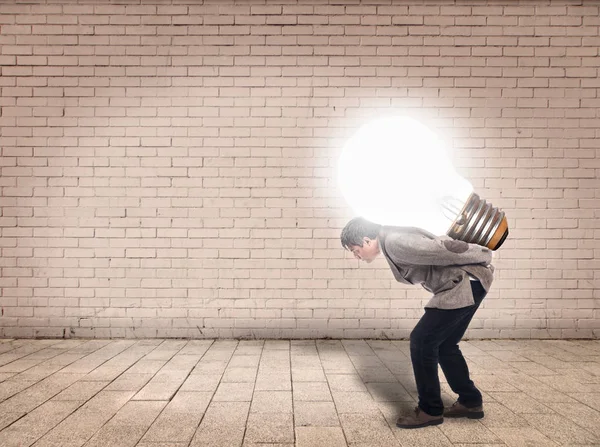 Businessman Holding Lightbulb — Stock Photo, Image