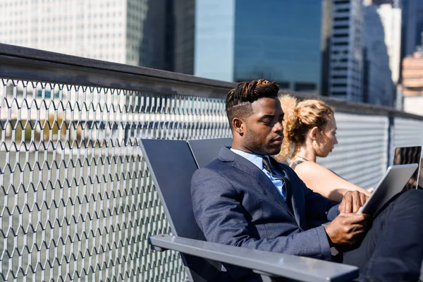 business persons sitting outside