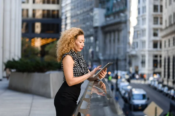 successful woman using tablet