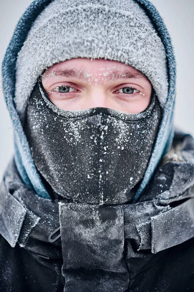 MAn\'s face covered with frost in winter