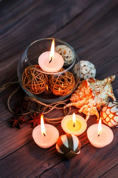 A candle in a glass vase, decoration and various interesting elements. Candles burning. — Stock Photo, Image