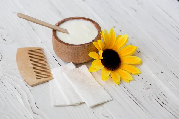 White substance in wooden cup with cinnamon and spices. — Stock Photo, Image