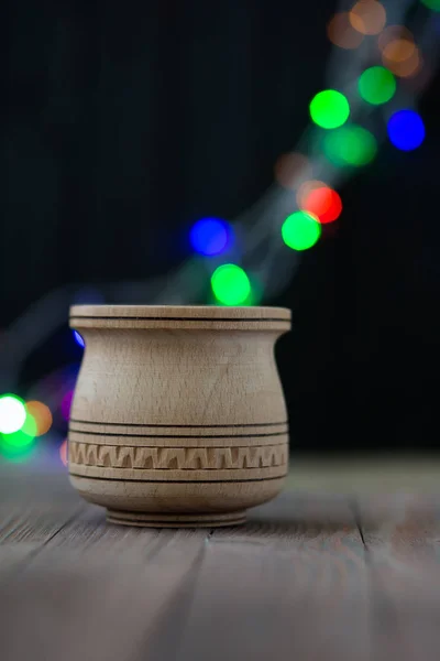 Magic wooden jar on sparkle background