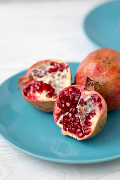 pomegranates on the kraft paper. Vegetarian food. Healthy food