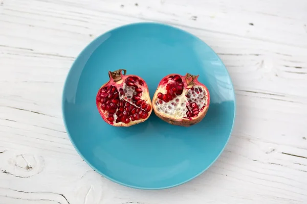 pomegranates on the kraft paper. Vegetarian food. Healthy food