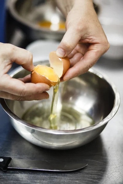 Chef Breaks Egg Steel Cup Professional Kitchen — Stock Photo, Image