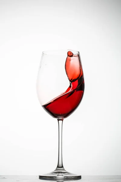 Red Wine Splashes Glass White Background — Stock Photo, Image
