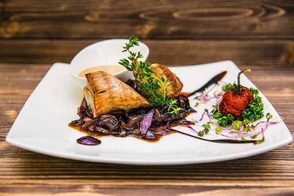 Food on a plate, on a wooden background.Food detail