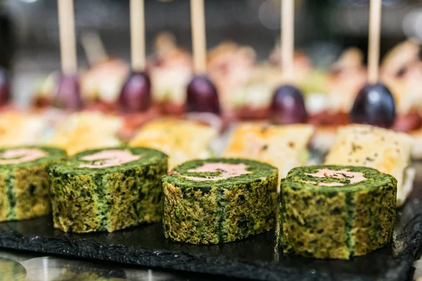 Detail of a canapes of a meal at an event, wedding, meeting or congress with food. Canapes decorated on the dish