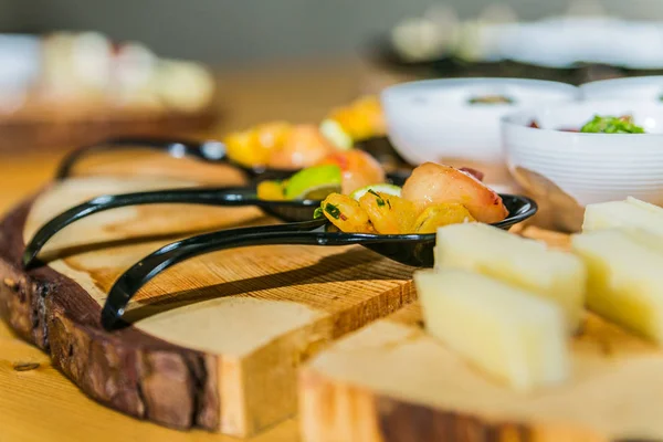 Detail of a canapes of a meal at an event, wedding, meeting or congress with food. Canapes decorated on the dish