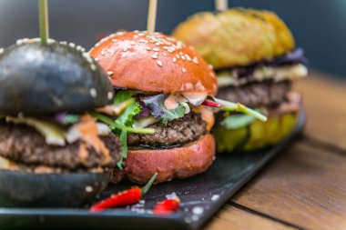 Sandwich hamburger with and mix of vegetables. Fast food. Delicious hamburger