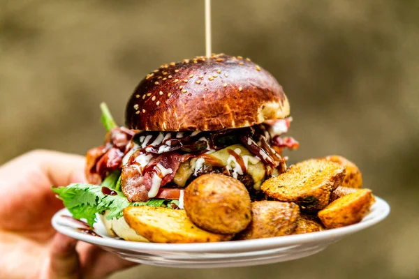 Sandwich hamburger with and mix of vegetables. Fast food. Delicious hamburger