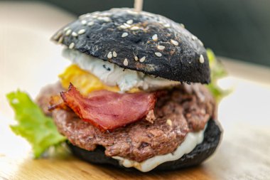 Sandwich hamburger with and mix of vegetables. Fast food. Delicious hamburger