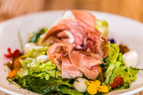 Fresh garden salad. Fresh garden salad on a plate. Fresh and healthy vegetable salad with ham