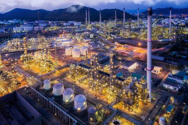 and scape of Oil refinery plant from bird eye view on night clipart
