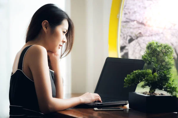 Asian officer take relax with computer