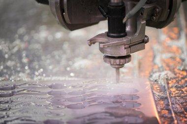 Metalworking cutting with water jet clipart
