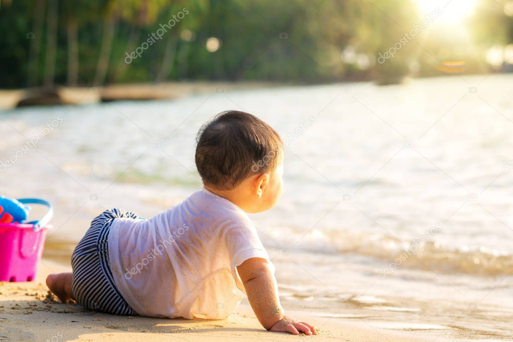 Asan baby play on the beach in Koh Kood