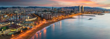 Barcelona beach on morning sunrise clipart