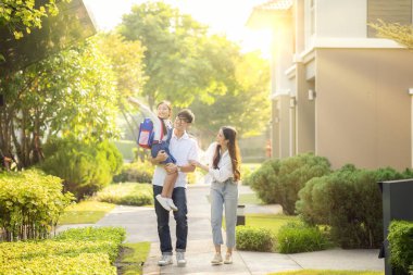 Asian family go to school together