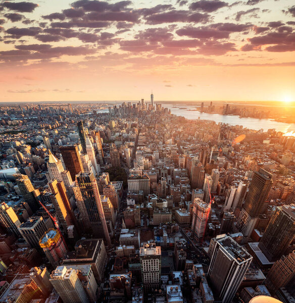 New York City skyline with urban skyscrapers at sunset, USA.