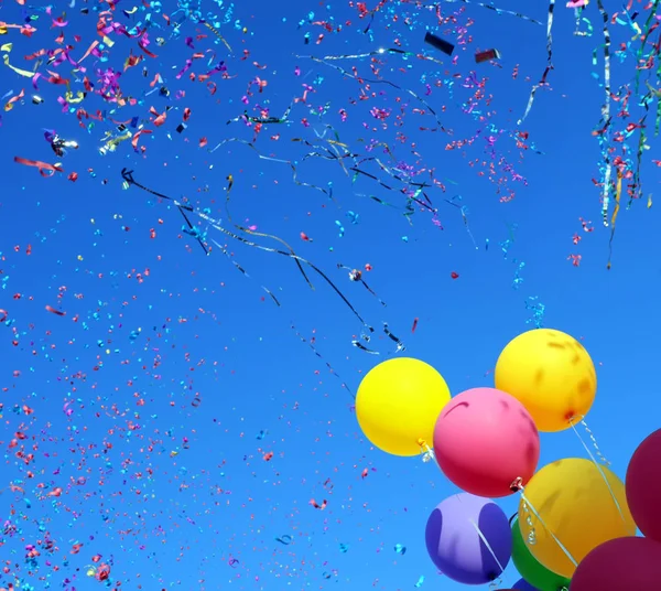 Multicolored balloons and confetti — Stock Photo, Image