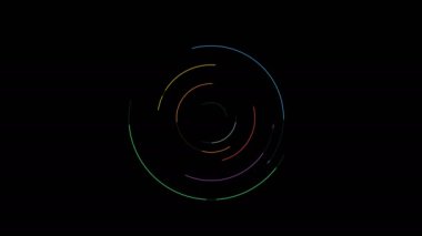 Siyah arka plan üzerine dönen dairesel farklı renkte parçacıklar.