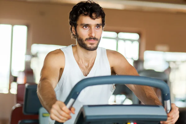 Man working out on a treadmill — Stock Photo, Image