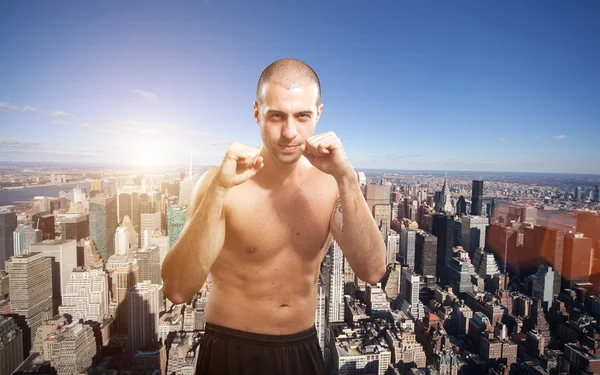 Fighter in front of a big city — Stock Photo, Image