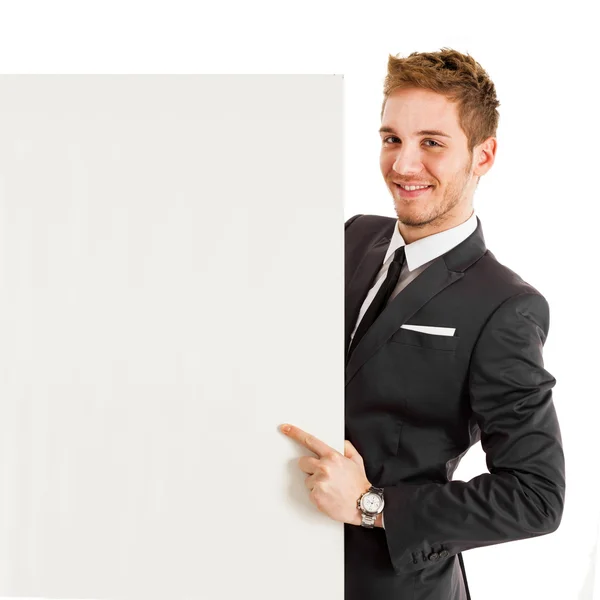 Businessman showing a white board — Stock Photo, Image