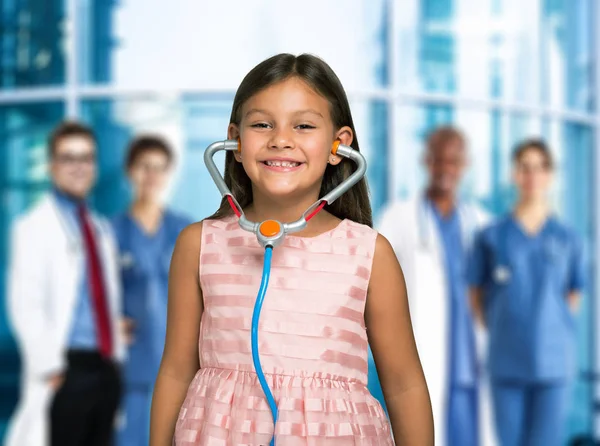 Child using a toy stethoscope — Stock Photo, Image