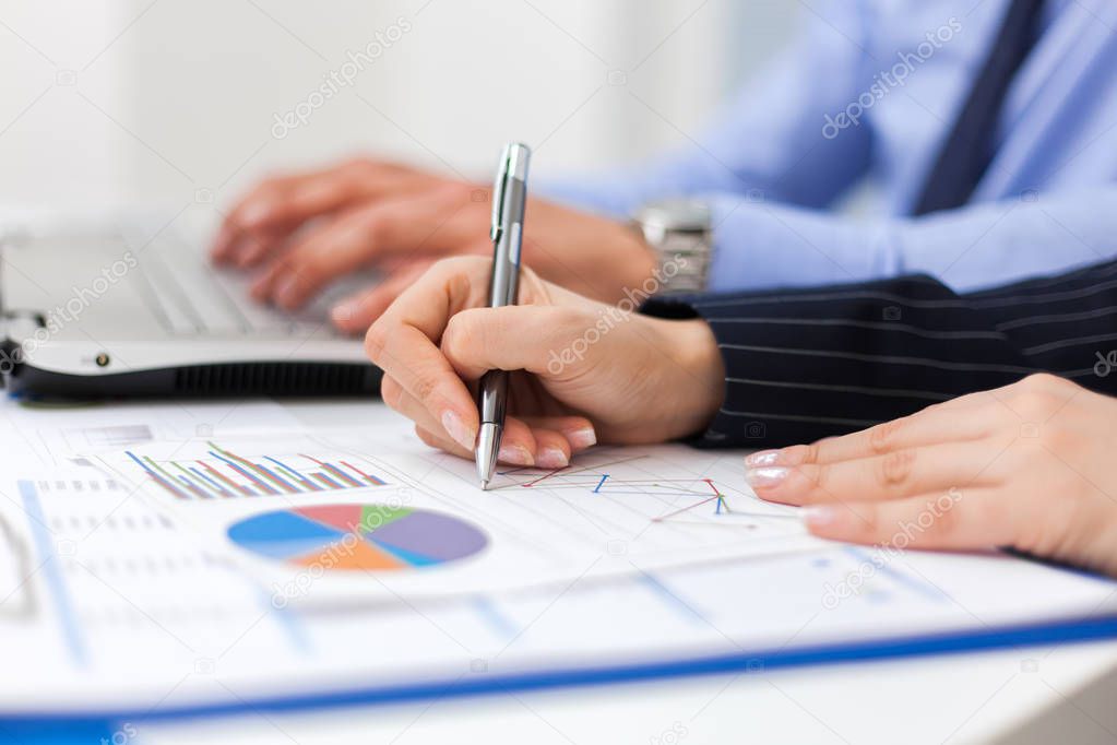 business people hands writing Graph analysis