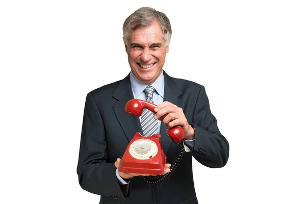 Businessman holding a traditional telephone — Stock Photo, Image