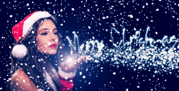 Woman blowing snow from her hand — Stock Photo, Image