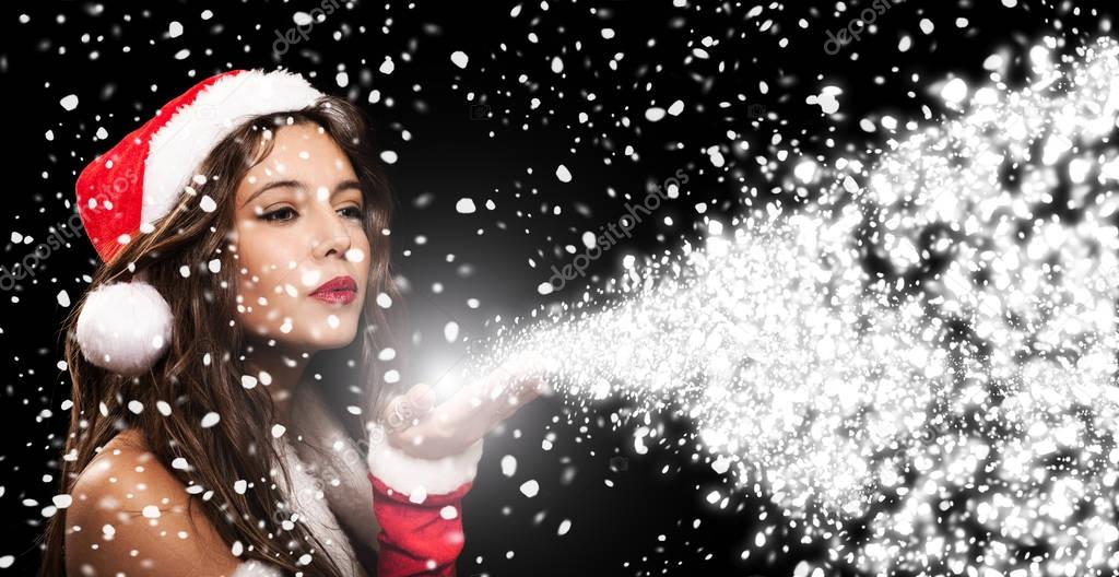 Christmas girl breathing magic snow