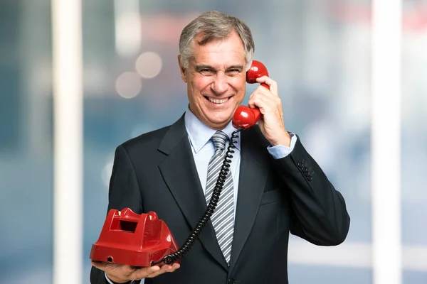 businessman talking on vintage phone