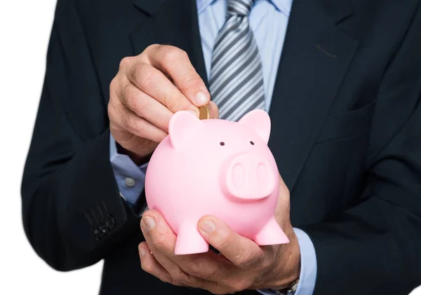 Piggy bank pénz elhelyezés ember — Stock Fotó