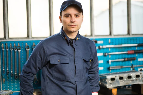 Mechanic in front of tools — Stock Photo, Image