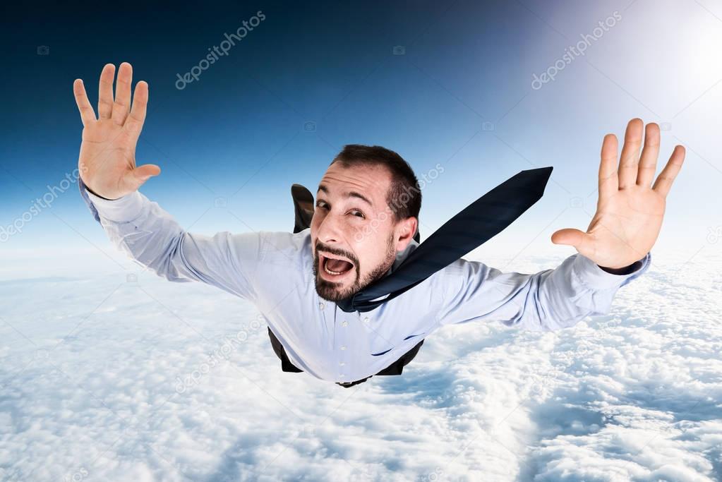 Terrified businessman falling from sky