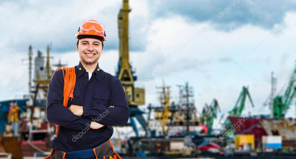 worker in front of harbor