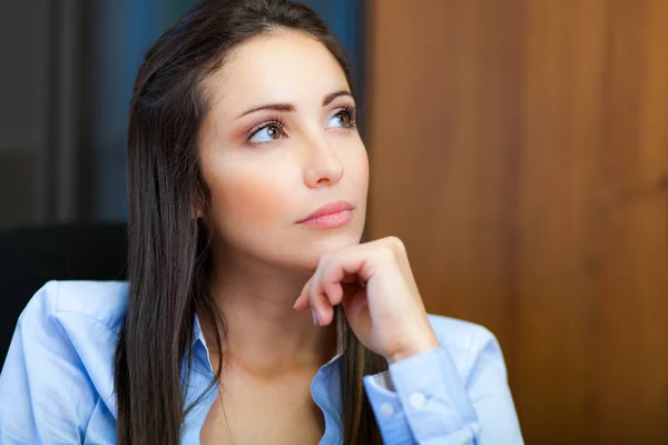 Pensive y woung businesswoman — Stock Photo, Image